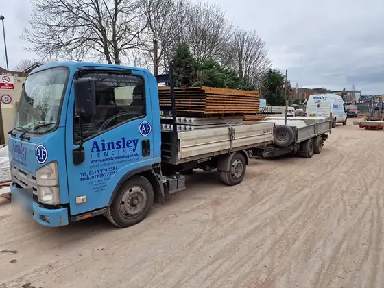 Ainsley Fencing lorry loaded with panels and concrete posts at the yard